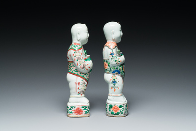 A pair of Chinese famille verte 'Hehe Er Xian' figures, Kangxi
