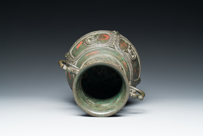 A Chinese gold and silver-inlaid bronze vase with pseudo-rust patina, 18th C.