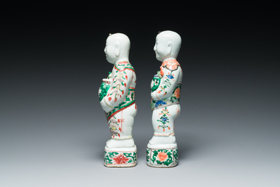 A pair of Chinese famille verte 'Hehe Er Xian' figures, Kangxi