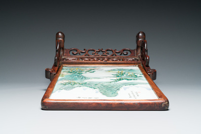 A Chinese famille verte plaque mounted in a wooden table screen, signed Li Huan 李澣, dated 1924