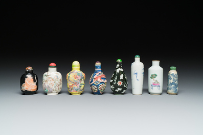 Eight Chinese blue and white, famille noire and famille rose snuff bottles, various marks, 19th C.