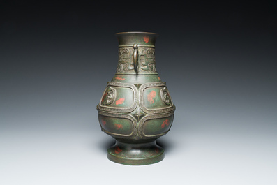 A Chinese gold and silver-inlaid bronze vase with pseudo-rust patina, 18th C.