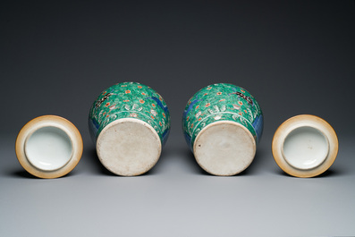 A pair of Chinese famille verte 'galloping horses' vases and covers, 19th C.