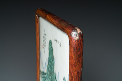A Chinese famille verte plaque mounted in a wooden table screen, signed Li Huan 李澣, dated 1924