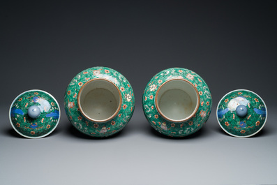 A pair of Chinese famille verte 'galloping horses' vases and covers, 19th C.