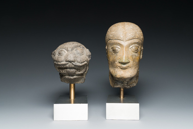 A Romanesque carved stone head of a man and a lion's head, probably Flanders, 13/15th C.