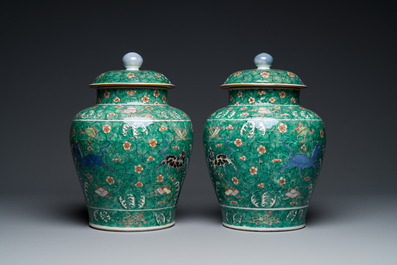 A pair of Chinese famille verte 'galloping horses' vases and covers, 19th C.