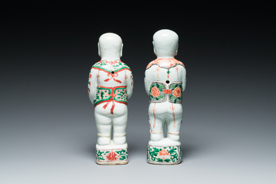 A pair of Chinese famille verte 'Hehe Er Xian' figures, Kangxi
