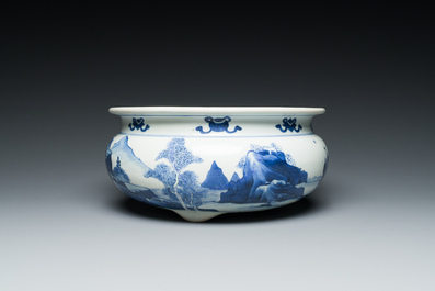 A Chinese blue and white tripod censer with figures in a mountainous landscape, Kangxi