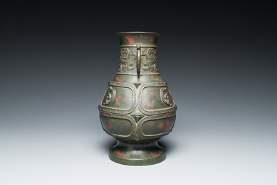 A Chinese gold and silver-inlaid bronze vase with pseudo-rust patina, 18th C.