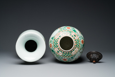 A Chinese famille rose vase and a famille verte jar with wooden cover, 19th C.