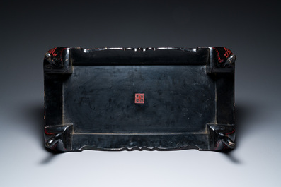 A Chinese rectangular carved red and black lacquer table, 'kang', Xuande mark, 20th C.