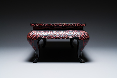 A Chinese rectangular carved red and black lacquer table, 'kang', Xuande mark, 20th C.