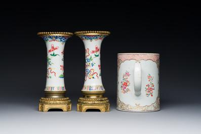 Une paire de vases en porcelaine de Chine famille rose aux montures en bronze dor&eacute; et une chope &agrave; sujet mandarin, Qianlong