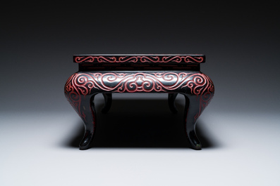 A Chinese rectangular carved red and black lacquer table, 'kang', Xuande mark, 20th C.