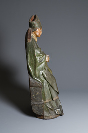 A large polychromed wood sculpture of a seated bishop, probably France, early 16th C.