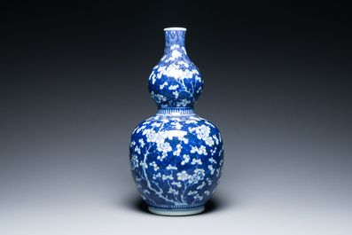 A Chinese blue and white double gourd 'prunus on cracked ice' vase, 18th C.