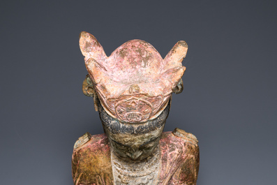 A Chinese polychromed stone sculpture of Guanyin, probaby Yuan/Ming