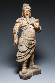 A large Chinese partly gilded and polychromed wood sculpture of Guandi, 17th C.