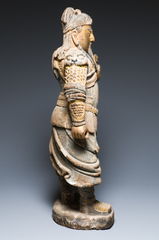 A large Chinese partly gilded and polychromed wood sculpture of Guandi, 17th C.
