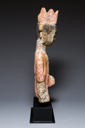 A Chinese polychromed stone sculpture of Guanyin, probaby Yuan/Ming