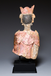 A Chinese polychromed stone sculpture of Guanyin, probaby Yuan/Ming
