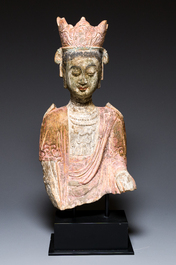 A Chinese polychromed stone sculpture of Guanyin, probaby Yuan/Ming