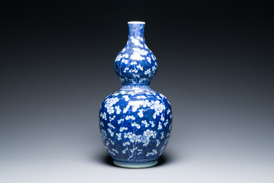 A Chinese blue and white double gourd 'prunus on cracked ice' vase, 18th C.