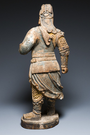 A large Chinese partly gilded and polychromed wood sculpture of Guandi, 17th C.