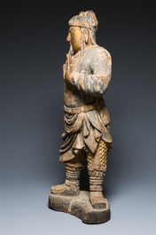 A large Chinese partly gilded and polychromed wood sculpture of Guandi, 17th C.