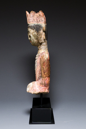 A Chinese polychromed stone sculpture of Guanyin, probaby Yuan/Ming