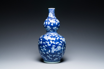 A Chinese blue and white double gourd 'prunus on cracked ice' vase, 18th C.