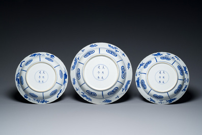 Three large deep Chinese blue and white 'hunting scene' dishes, Chenghua mark, Kangxi