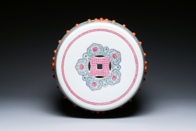 A Chinese famille rose garden seat with ladies in a garden, 20th C.