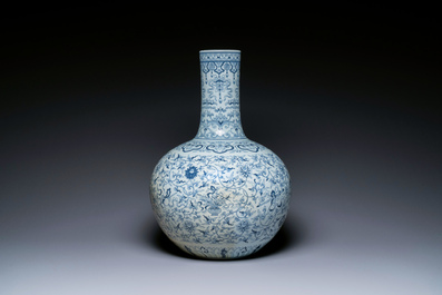 A large Chinese blue and white bottle vase, Qianlong mark, 19/20th C.