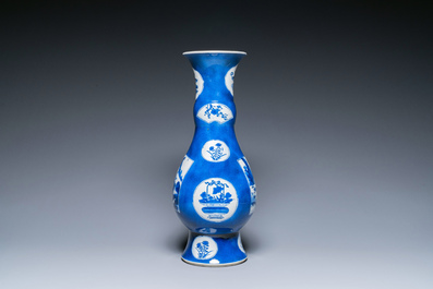 Een Chinese poederblauwe flesvormige vaas met landschapspanelen, Kangxi