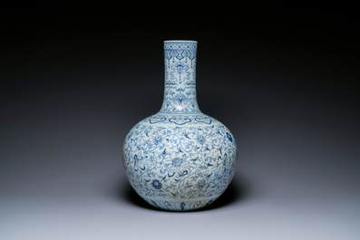 A large Chinese blue and white bottle vase, Qianlong mark, 19/20th C.
