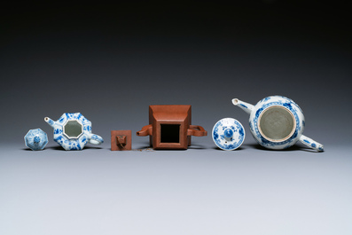 Twee Chinese blauw-witte theepotten, &eacute;&eacute;n in Yixing en een poederblauwe kop en schotel, Kangxi en later