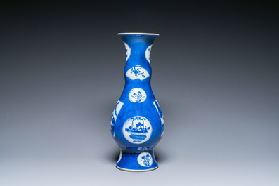 Een Chinese poederblauwe flesvormige vaas met landschapspanelen, Kangxi