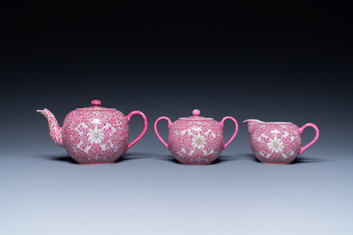 A Chinese 15-piece tea service with lotus scrolls on a purple ground, Guangxu mark, 20th C.