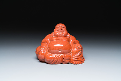 A Chinese emerald green jadeite 'birds' group and a goldstone sculpture of Buddha, 19/20th C.