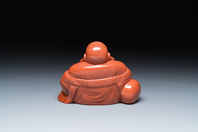 A Chinese emerald green jadeite 'birds' group and a goldstone sculpture of Buddha, 19/20th C.