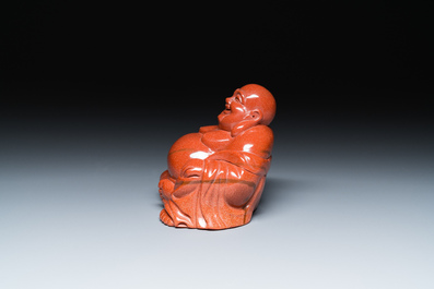 A Chinese emerald green jadeite 'birds' group and a goldstone sculpture of Buddha, 19/20th C.