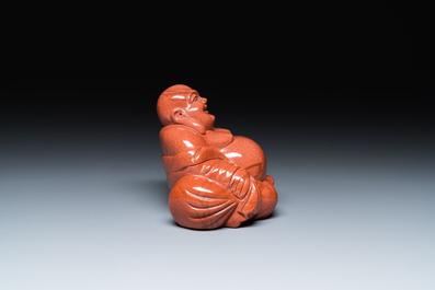 A Chinese emerald green jadeite 'birds' group and a goldstone sculpture of Buddha, 19/20th C.