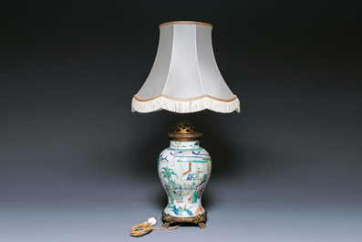 Un vase en porcelaine de Chine famille verte mont&eacute; en lampe, Kangxi