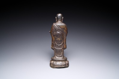 A Chinese gilt bronze standing Buddha, Ming