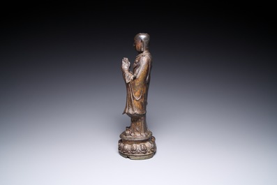 A Chinese gilt bronze standing Buddha, Ming