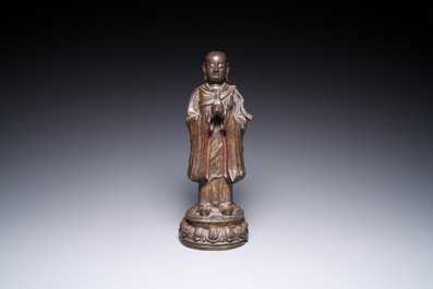 A Chinese gilt bronze standing Buddha, Ming