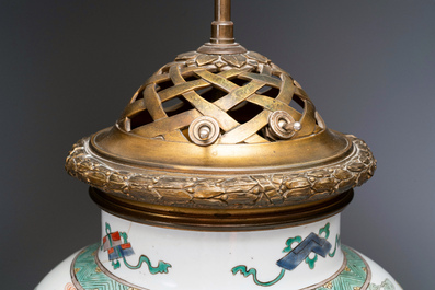 Un vase en porcelaine de Chine famille verte mont&eacute; en lampe, Kangxi