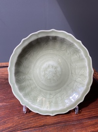 A Chinese Longquan celadon lotus-form dish with underglaze floral design, Ming